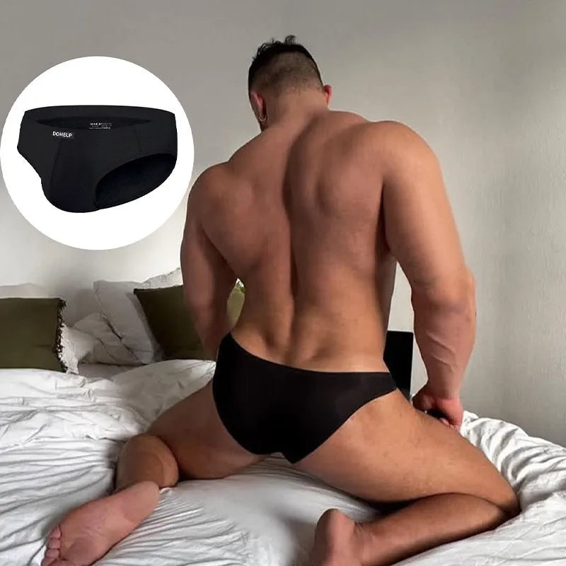 Seamless men's briefs in solid colours with low waist hip lifting design