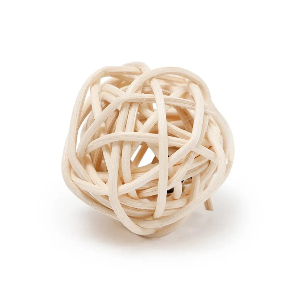 Two cat toys: a hollow rattan ball and a faux feather ball with a bell on a white background.