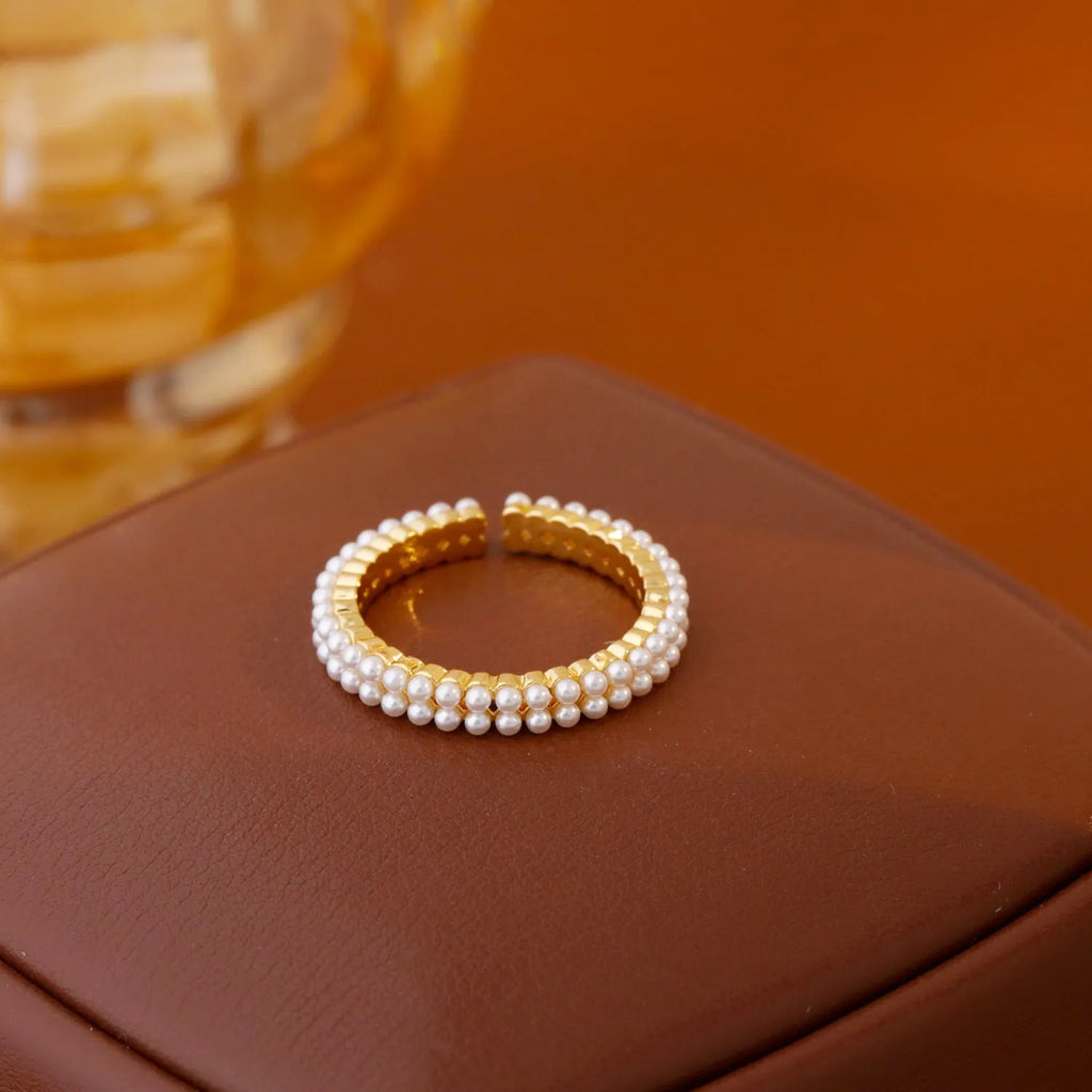 Gold geometric open-mouth women's ring with round pearl detailing on electroplated copper