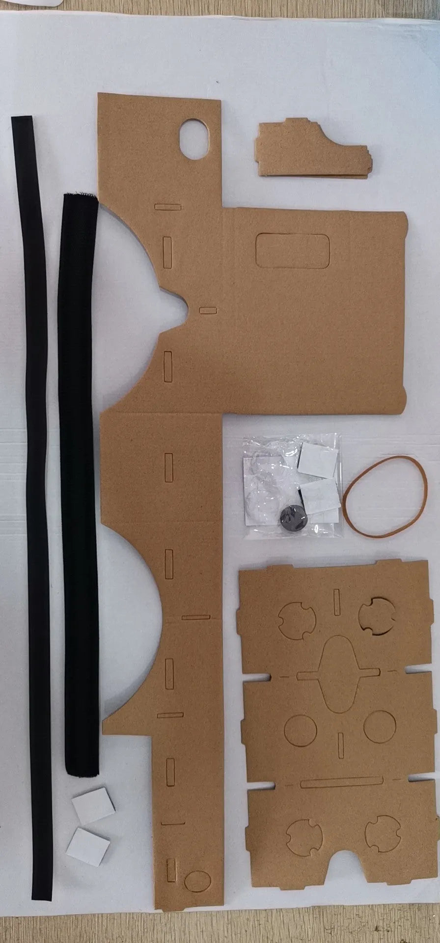 Pink cardboard VR glasses with 3D lenses and adjustable rubber band head strap for smartphones
