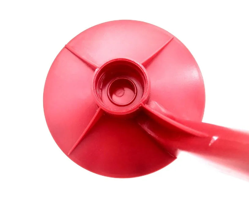 Red plastic Magic Tap soda bottle dispenser attached to a 2-litre bottle