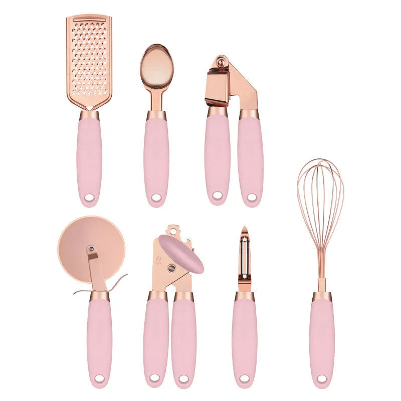 7-piece stainless steel kitchen tool set with copper plating peeler gadget in a cutlery rack on a countertop