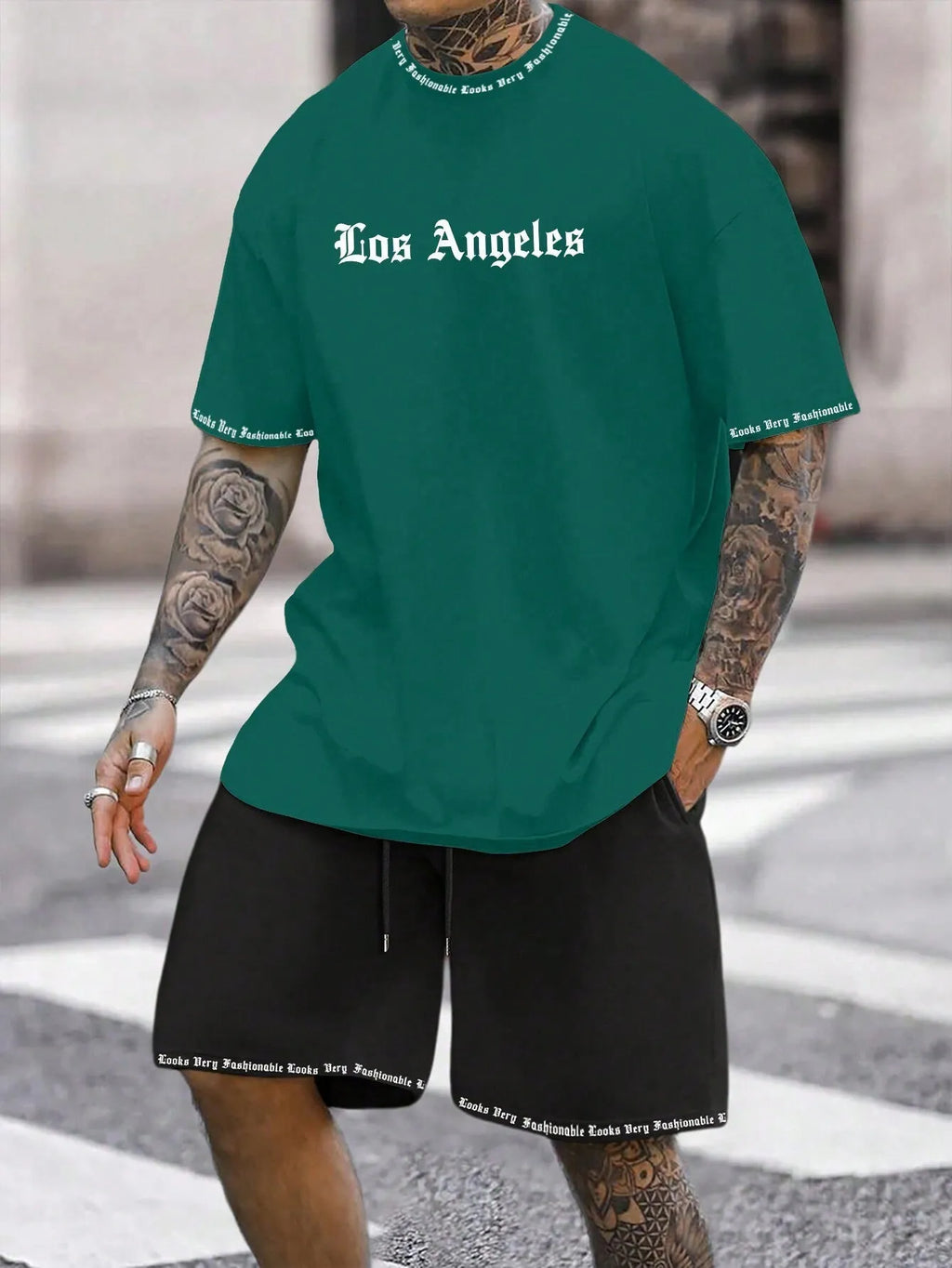 Sports style short-sleeved top and matching shorts set laid flat, showing thin polyester blend fabric.