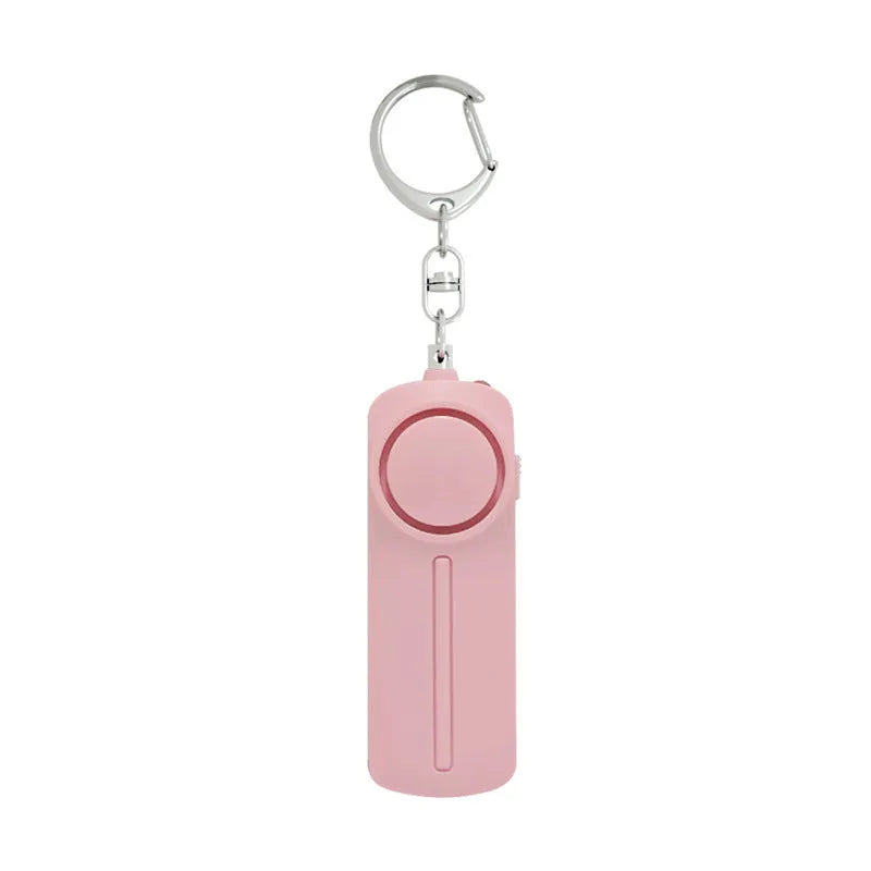 Compact pink personal safety alarm with keyring, shown at 86mm long.
