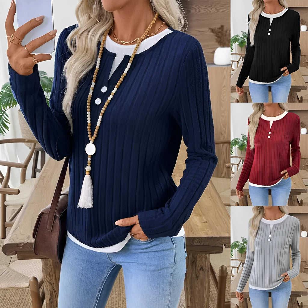Women's black fake two-piece round neck button pullover sweater with long sleeves on a hanger.