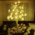60cm Christmas rose shining tree lamp with pink and white flower-shaped PVC lights on a tabletop