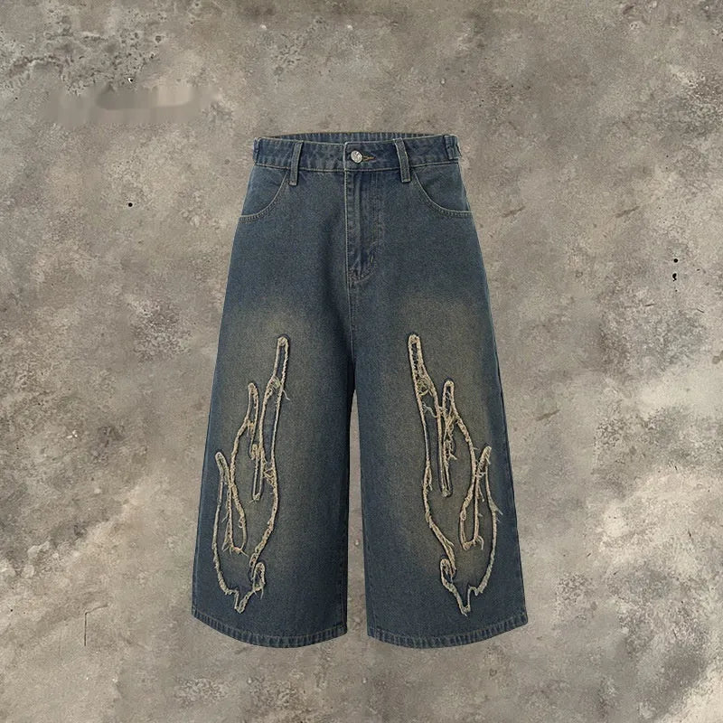 Men's black denim shorts with flame embroidery patches on leg, straight cut streetwear style