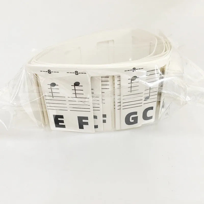 Set of white cardboard piano note stickers for 88-key keyboard, showing colour bars or black notes option.