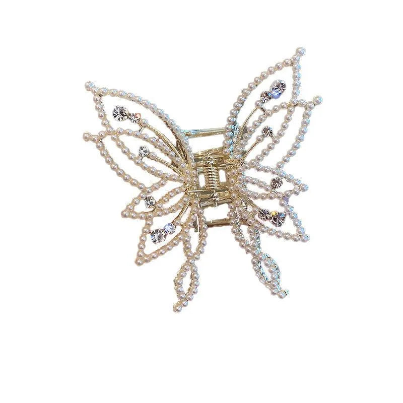 Butterfly hair barrettes in alloy with rhinestone or pearl styles measuring 6.7x6.2cm