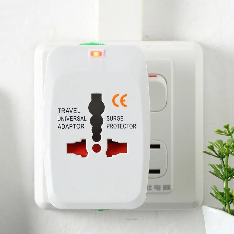 White universal travel plug adapter with two USB ports and flat-top socket showing AU, EU, US, UK plug compatibility