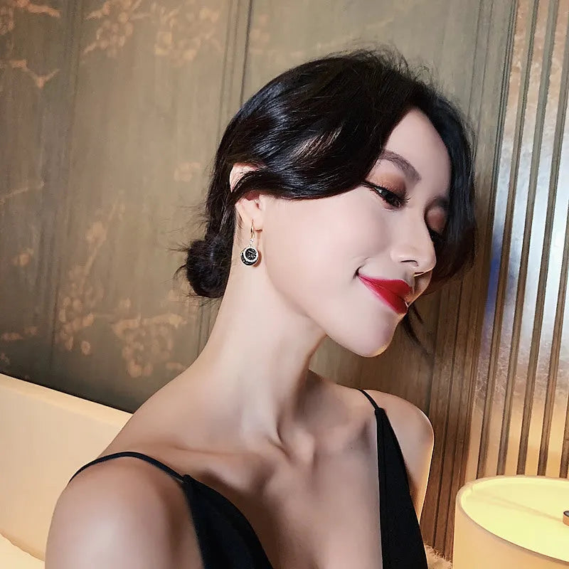 Black geometric alloy earrings with round piece design measuring 3.6cm in length