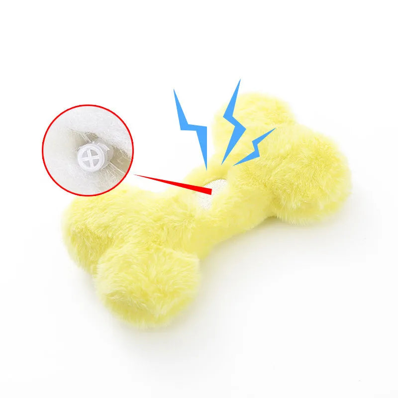 Plush bone-shaped dog toy in blue, pink or yellow with a squeaker for interactive chewing play.