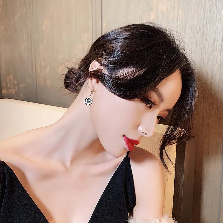 Black geometric alloy earrings with round piece design measuring 3.6cm in length