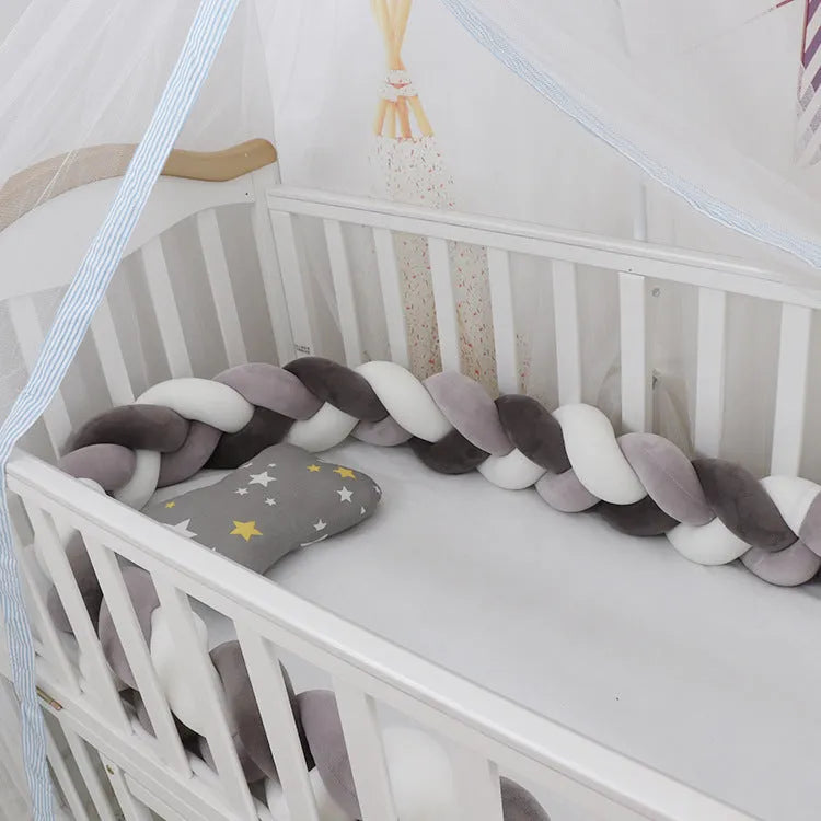 Baby crib bumper braid knot pillow cushion in spandex velvet, shown in a light grey colour