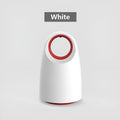 Black or white plug-in silent mosquito killer with UV light on a table next to a USB cable