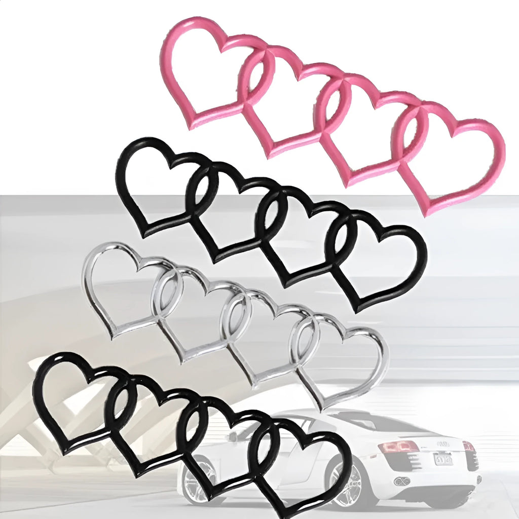 Heart-shaped body sticker with four-ring tail design in electroplated silver colour on a car bumper