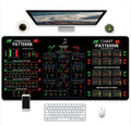 Game-themed printed rubber mouse pad with non-slip base on a desk.