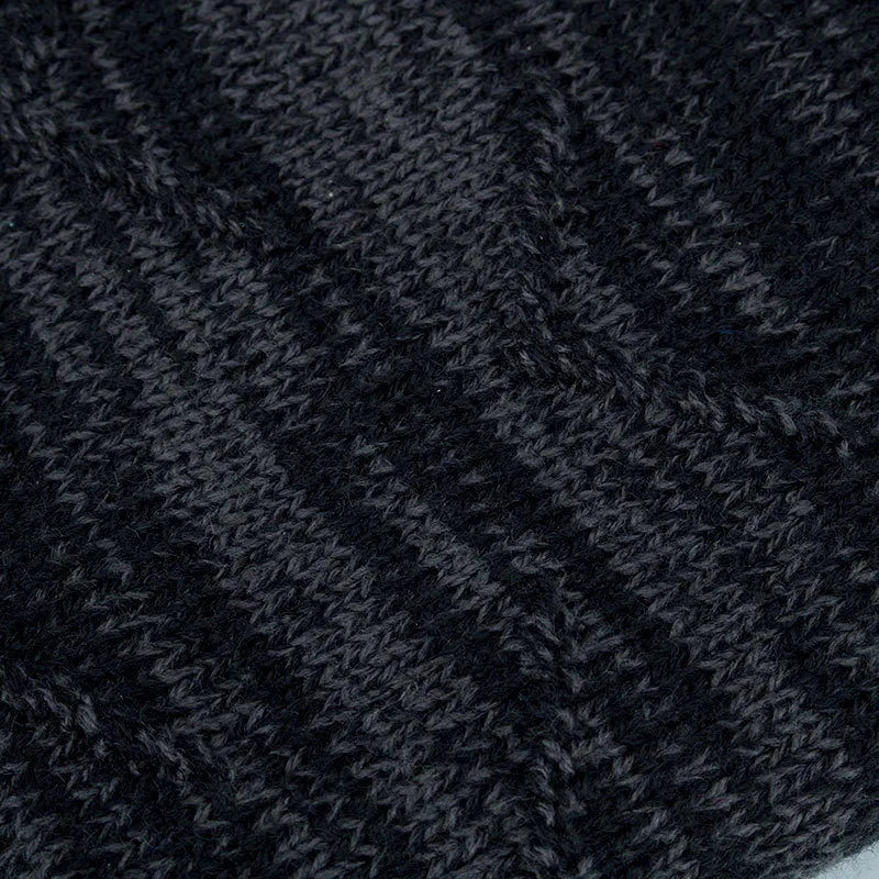 Diagonal hook knitted acrylic beanie in black, showing textured knit pattern