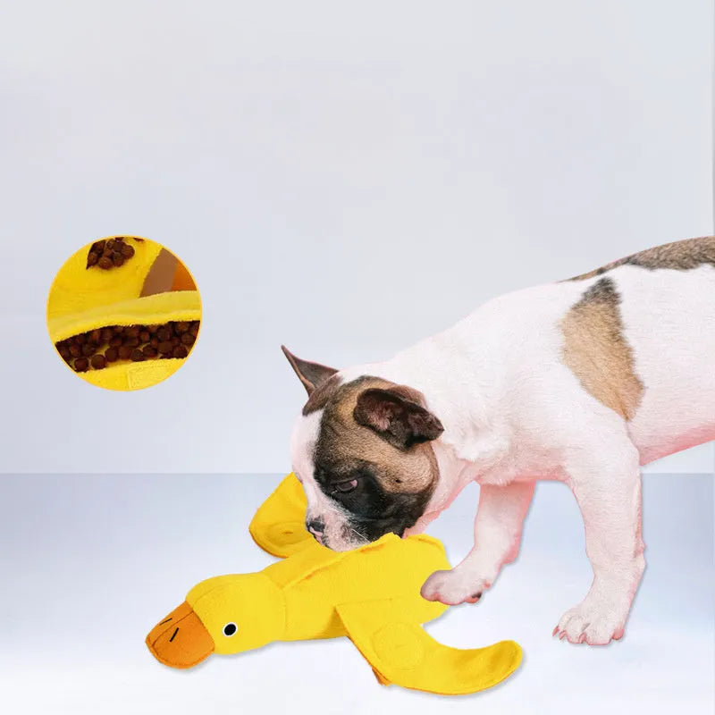 Yellow teddy bear shaped dog toy with food leak compartment and squeaker for training and enrichment