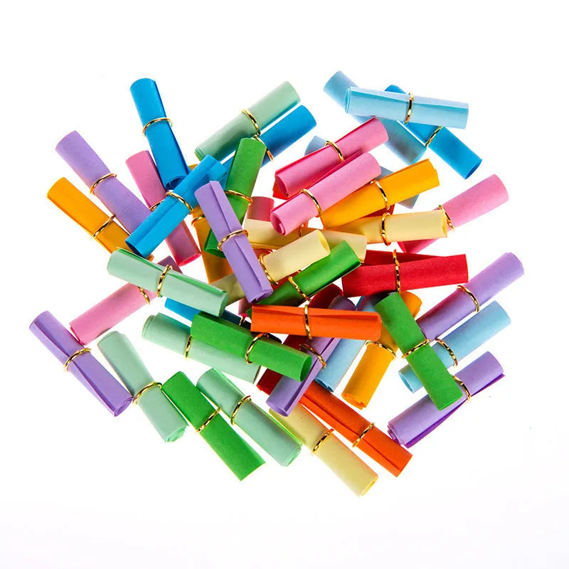 Assorted coloured mini paper scrolls with metal eyelets in sizes 3x7cm, 4x7cm, 5x5cm and 7x7cm.