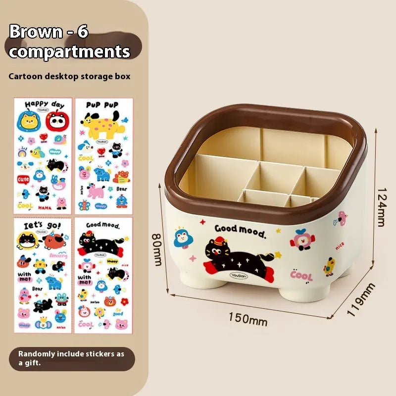 Red and brown cartoon sticker designs on a plastic desktop storage box with grid organiser compartments.