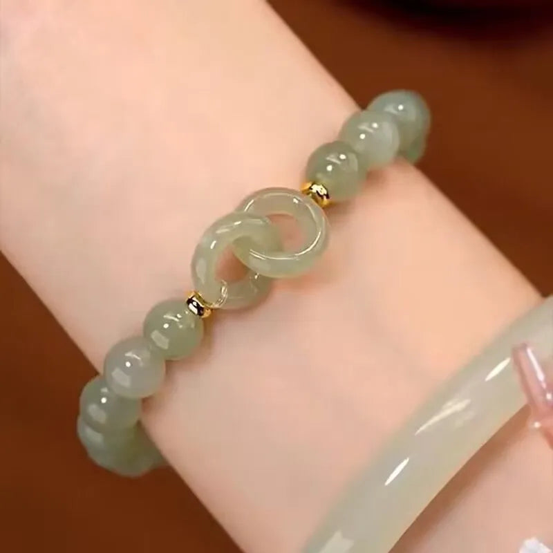 Chinese style bamboo leaf glass bracelet for women with a bamboo joint design.