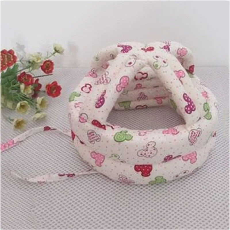 Baby anti collision hat with high-density sponge padding, adjustable headband, breathable cotton outer, colourful design