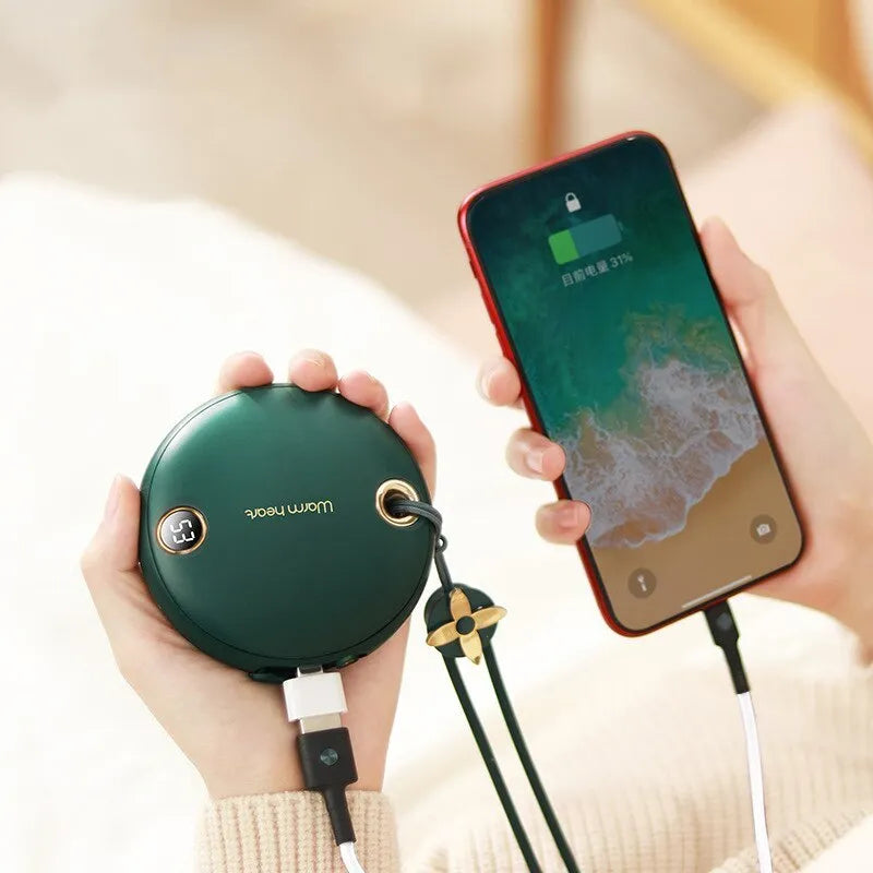 Green portable power bank with digital display and integrated hand warmer heater for phone charging