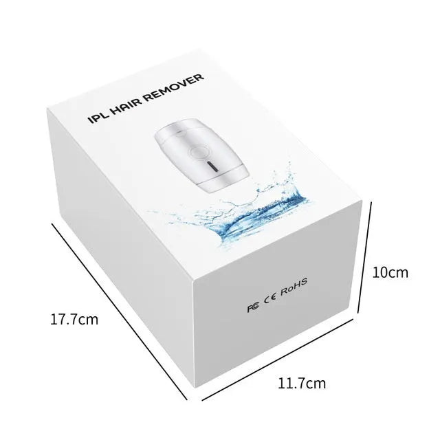 White home laser hair removal instrument with display, showing compact size and included adapter.
