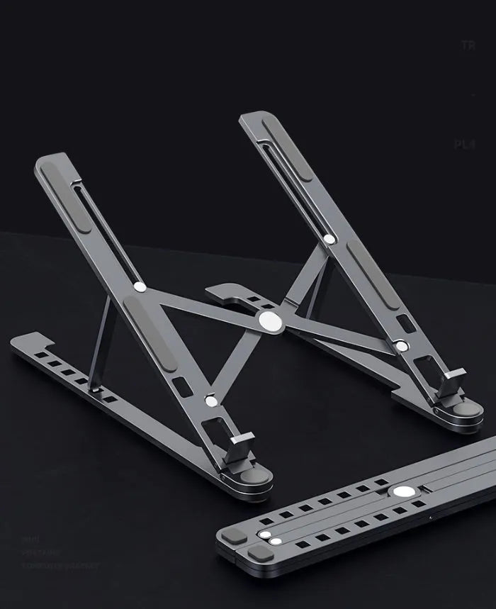 Foldable aluminium laptop stand in silver showing adjustable height mechanism and compact folded size