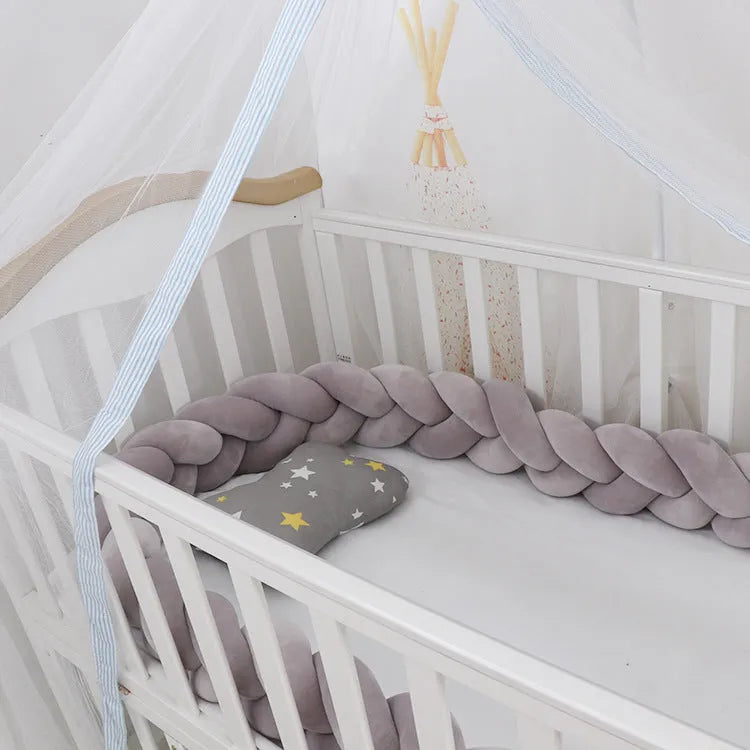 Baby crib bumper braid knot pillow cushion in spandex velvet, shown in a light grey colour