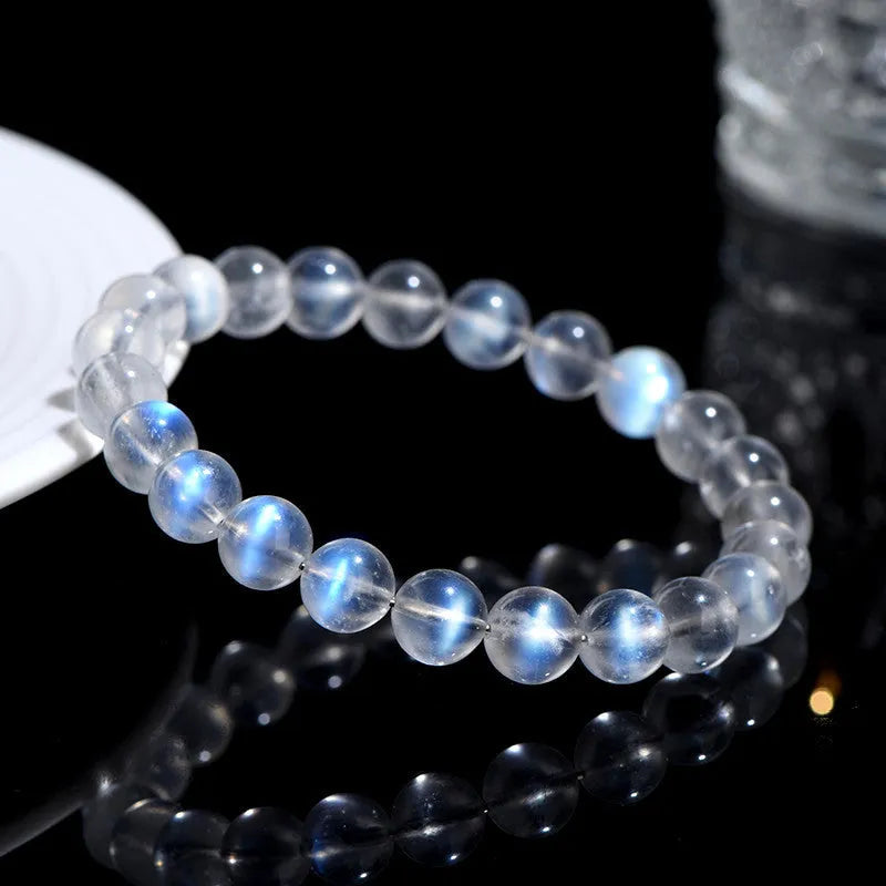 Natural cream body blue moonlight crystal bracelet with grinding finish on wrist