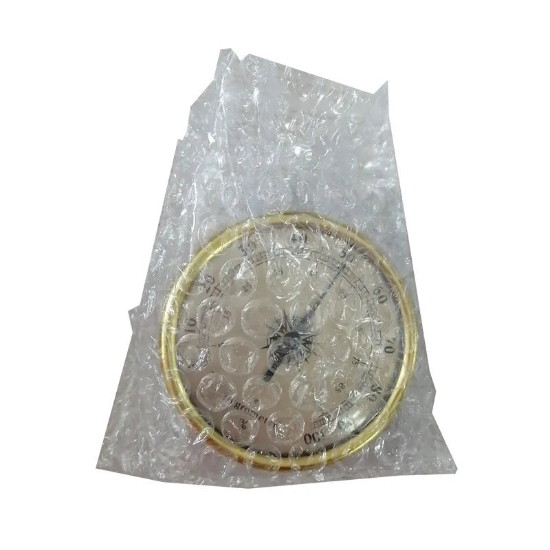 Analogue thermometer and hygrometer with aluminium outer ring and dial for indoor climate monitoring
