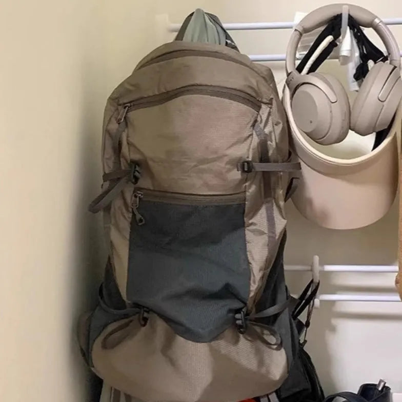 Natural revival khaki light solid colour nylon backpack with contrast details and curved shoulder straps