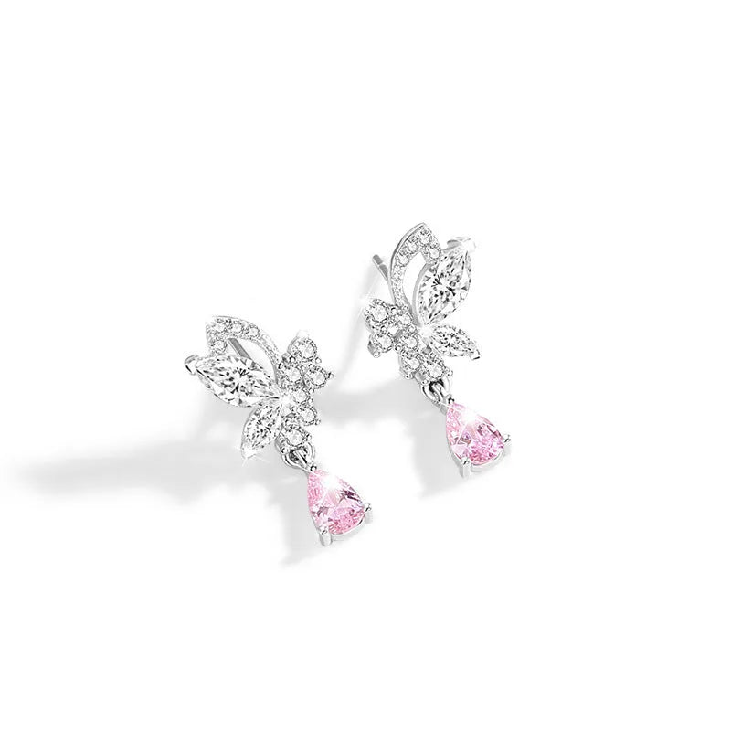 Close-up of women's butterfly stud earrings in sterling silver with clear rhinestone details.