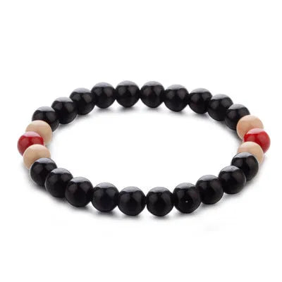 Natural lava stone beaded bracelet with ethnic style on a wrist.