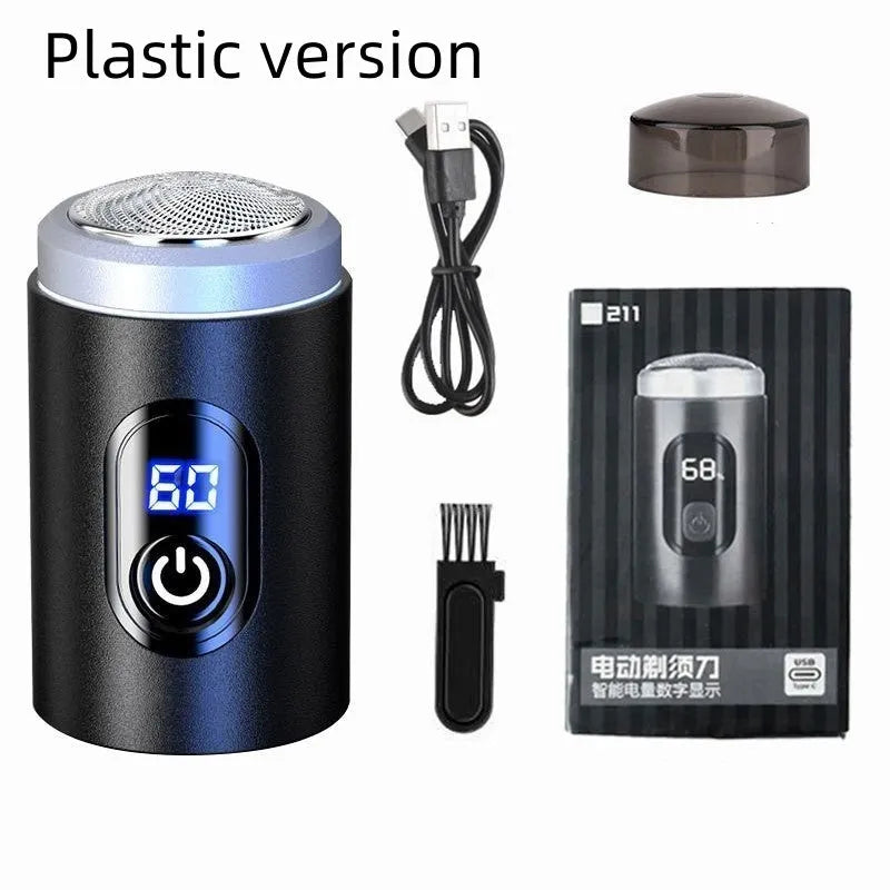 Black mini rechargeable electric shaver with USB cable and cleaning brush on a white background