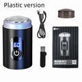 Black mini rechargeable electric shaver with USB cable and cleaning brush on a white background