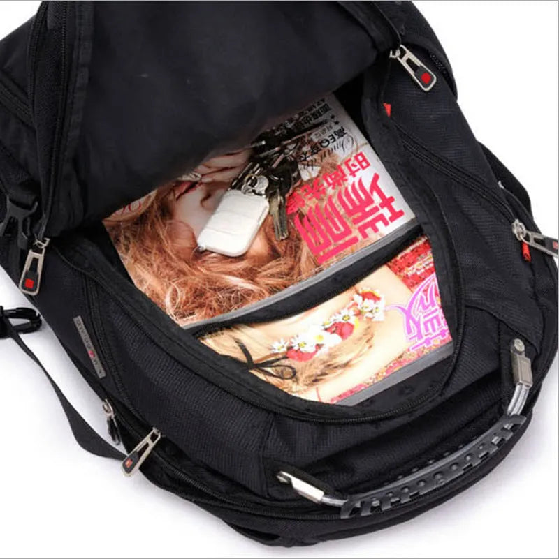 Black business computer backpack open to show three compartments and laptop sleeve.