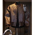 Men's black PU leather jacket with litchi pattern texture and extended length, shown in slim-fit light business style