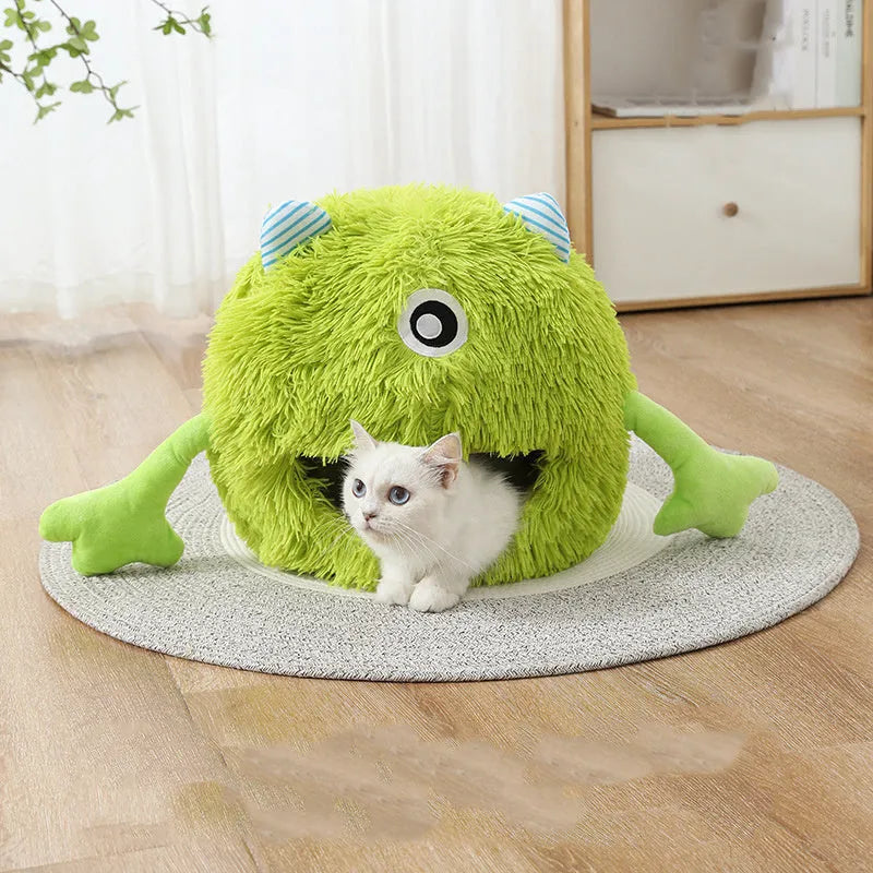 Fluffy round plush cat bed with a non-slip base, shown in a home setting.