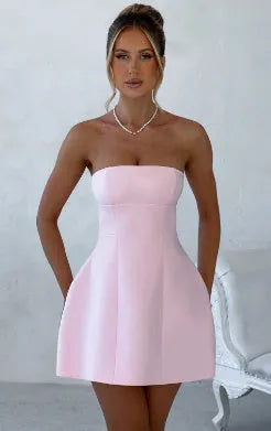 Women's solid colour backless tube dress with A-line skirt and high waist in various colours.