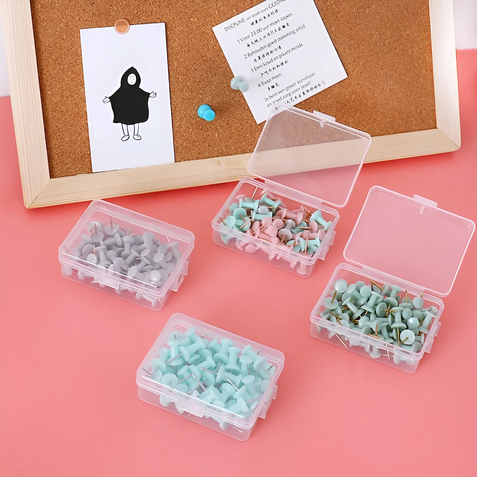 50-piece pack of Morandi colour push pins with three different pin head styles on a cork board.