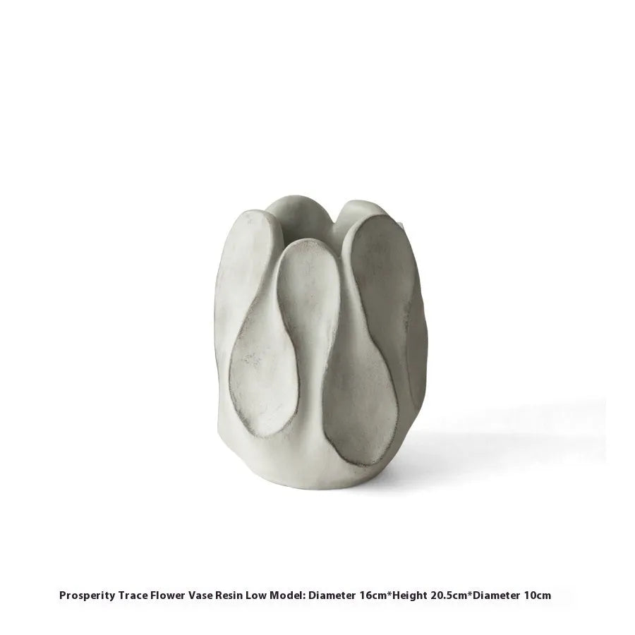 Irregular art ceramic vase in magnesium clay material displayed in high and low style options