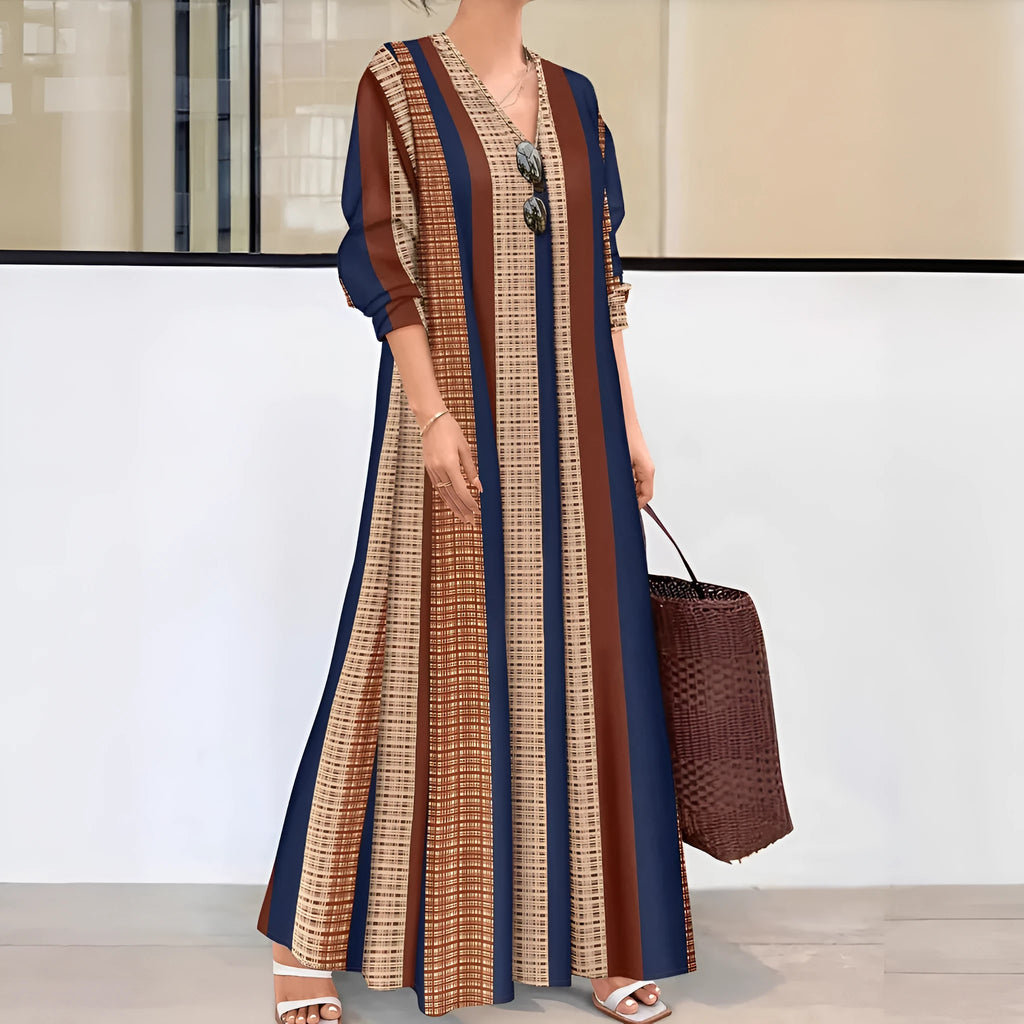 Camel coloured women's long dress with vertical stripes, V-neck, and long sleeves on a mannequin.