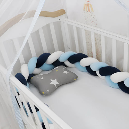 Baby crib bumper braid knot pillow cushion in spandex velvet, shown in a light grey colour