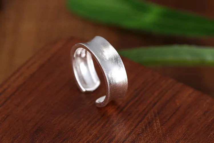 Adjustable geometric open ring with a Korean frosted sterling silver finish.