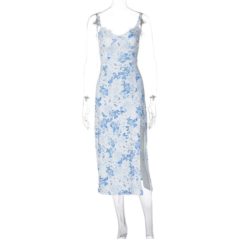 Women's long blue dress with lace flower print, suspender straps, and a high side slit.