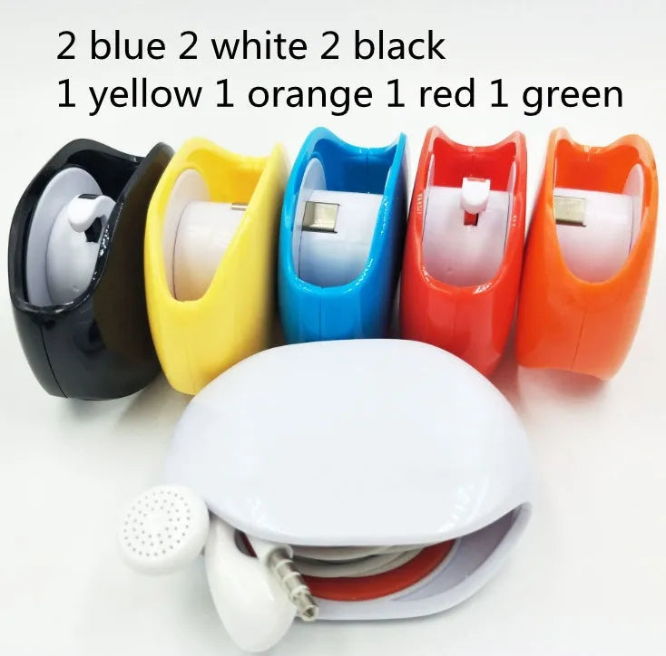 Automatic earphone cable retractor winder in a compact plastic storage box.