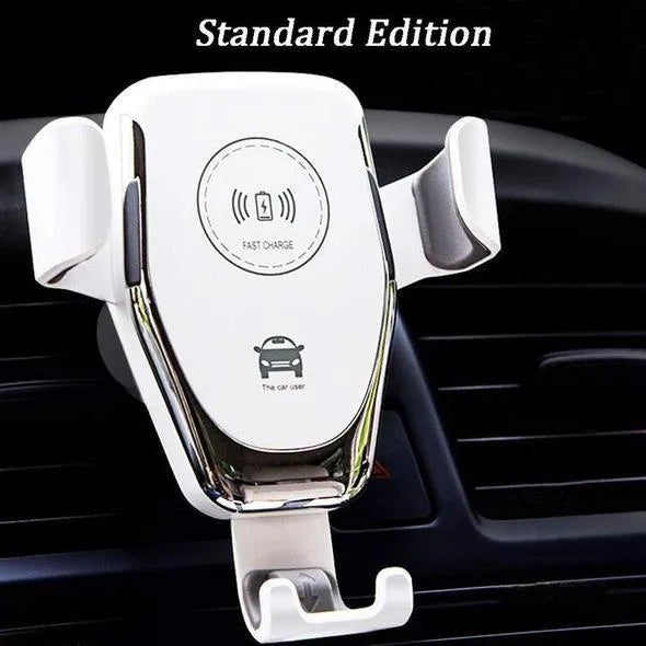 Black car wireless phone charger mounted on a vehicle vent, holding an iPhone.
